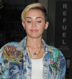 Miley Cyrus puts break-up heartache on ice to perform at pop festival