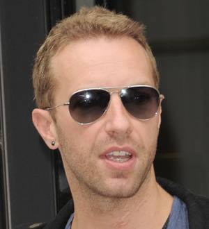 Chris Martin performs at Unbroken party