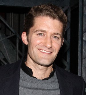 Matthew Morrison sings the national anthem before a World Series baseball game, standing on the field