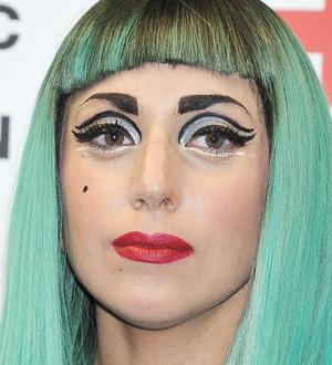 Lady Gaga takes surf lessons
