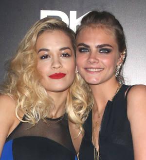 Cara Delevingne hits the stage to perform with Rita Ora