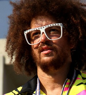 Redfoo coaching junior tennis player