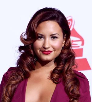 Lovato overcomes illness to continue tour
