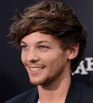 Louis Tomlinson suffering voice troubles
