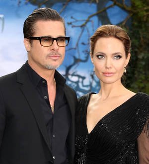 Brad Pitt and Angelina Jolie enjoy tea with British royals