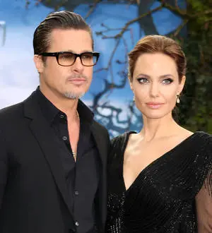 Brad Pitt and Angelina Jolie enjoy tea with British royals