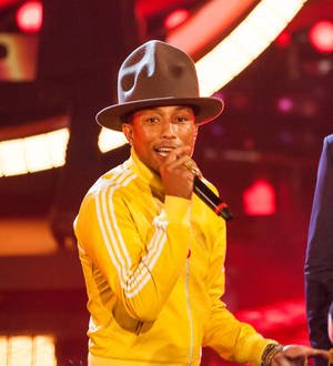 Fast food chain bosses win Pharrell Williams' hat at auction