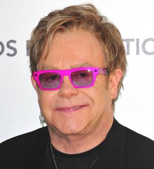 Sir Elton John raises millions for charity