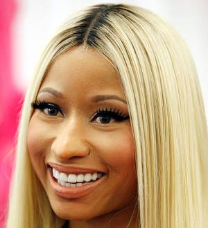 Nicki Minaj goes topless as bondage cop for Halloween