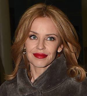 Kylie Minogue fights back tears remembering Michael Hutchence