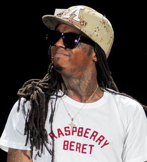 Lil Wayne returns to the top of chart with almost a million sales