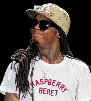 Lil Wayne returns to the top of chart with almost a million sales