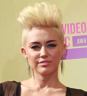PETA bosses adopt pig as Miley Cyrus turns 20
