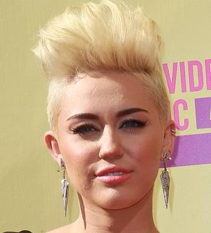 Miley Cyrus turns down racy roles to avoid upsetting her fiance