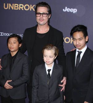 Brad Pitt steps in for sick Angelina Jolie at Unbroken premiere