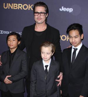Brad Pitt steps in for sick Angelina Jolie at Unbroken premiere