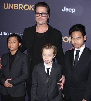 Brad Pitt steps in for sick Angelina Jolie at Unbroken premiere