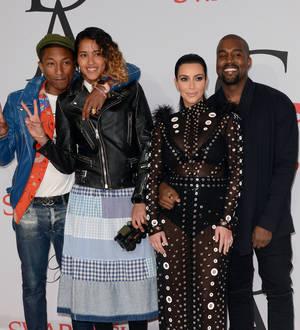 Pharrell Williams and wife 'save' Kim Kardashian after dress catches fire