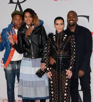 Pharrell Williams and wife 'save' Kim Kardashian after dress catches fire