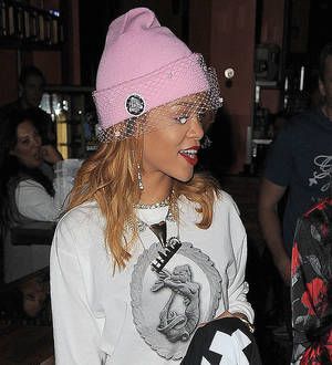 Rihanna courts controversy with joint pictures
