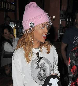 Rihanna courts controversy with joint pictures