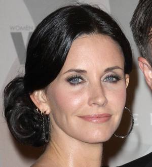 Courteney Cox laughs off Arquette's advances at Disney World