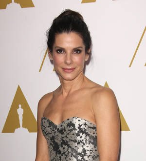 Sandra Bullock feted by leading men McConaughey, Reeves and Grant