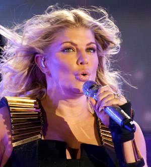 Black Eyed Peas raise million with rain-soaked charity concert
