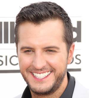 Luke Bryan falls off stage during show