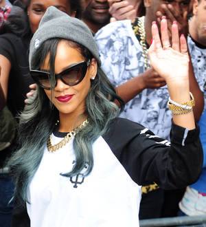 Rihanna wipes away tears at emotional French gig