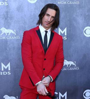 Jake Owen gets emotional about marriage split onstage at festival