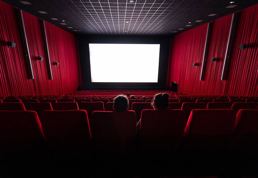 Here are some alt text options, assuming no celebrity is clearly visible and the image is of a movie theater: Option 1 (general theater…