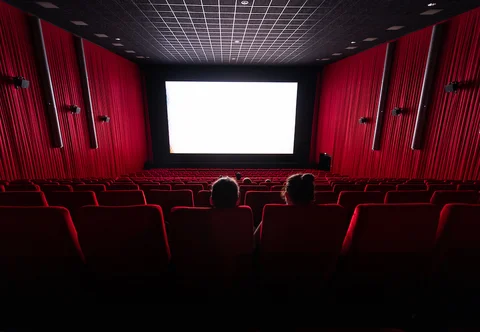 Here are some alt text options, assuming no celebrity is clearly visible and the image is of a movie theater: Option 1 (general theater…