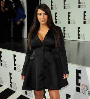 Kim Kardashian takes aim at paparazzi after crash scare