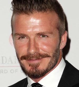 David Beckham surprises fans with photo booth visit