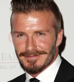 David Beckham surprises fans with photo booth visit