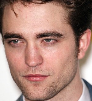Robert Pattinson's a godfather