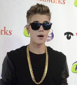 Justin Bieber looks after basketball star's son