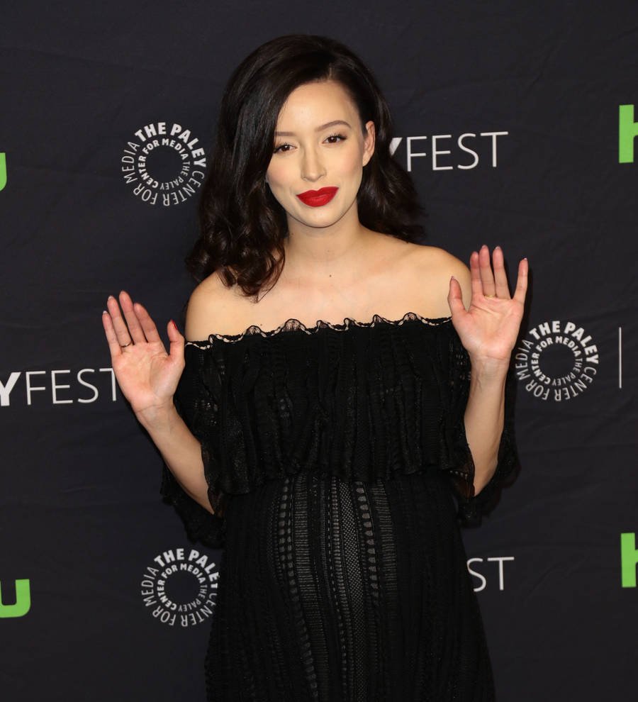 Christian Serratos as Rosita, bloodied, stares intensely ahead in a still from The Walking Dead