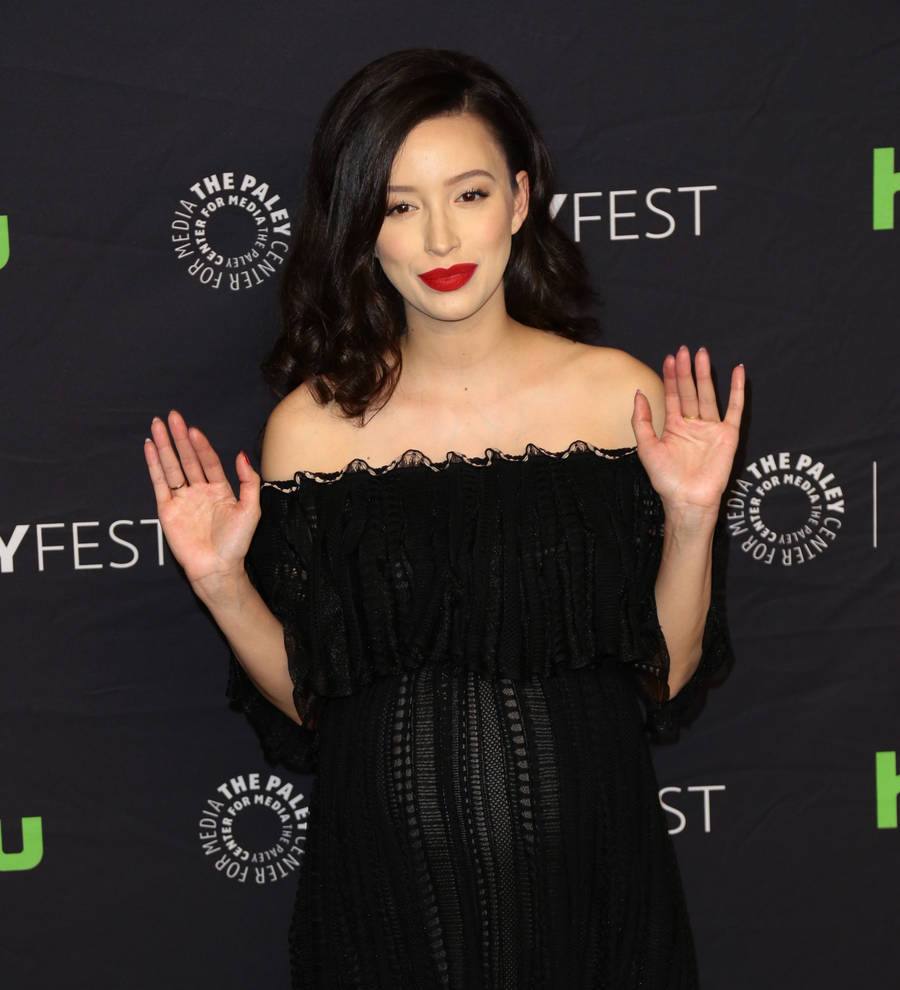 Christian Serratos as Rosita, bloodied, stares intensely ahead in a still from The Walking Dead