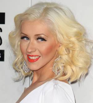 Pregnant Christina Aguilera strips for revealing magazine spread