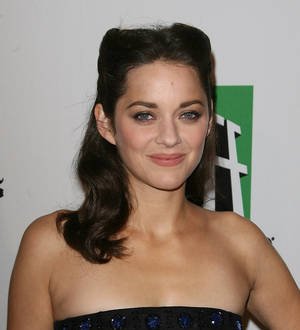 Marion Cotillard tenses up listening to Katy Perry