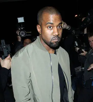 Kanye West in and out of jail for booking over paparazzo attack
