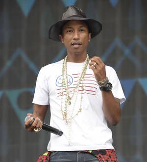 Pharrell Williams hugs Harlem's tree of life before Apollo Theater gig
