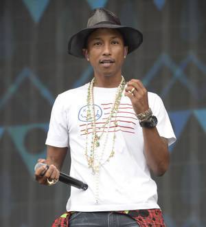 Pharrell Williams hugs Harlem's tree of life before Apollo Theater gig
