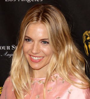 Sienna Miller donates to charity auction