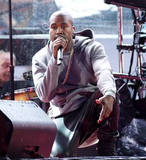Kanye West signs backing dancer to music label