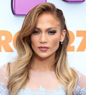 Jennifer Lopez gets covered with confetti at Los Angeles airport