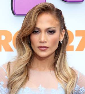 Jennifer Lopez gets covered with confetti at Los Angeles airport