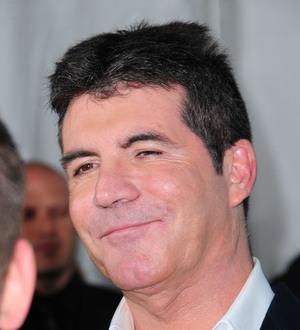 Cheryl Cole's flying high after Simon Cowell birthday message